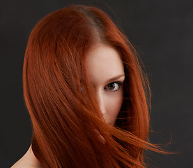 Image showing Woman, portrait or ginger hair care in studio with soft texture, keratin treatment or cosmetics glow. Model, face or natural beauty with salon hairstyle, shampoo growth or results on black background