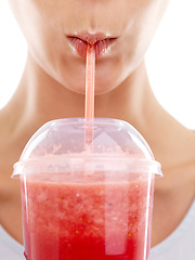 Image showing Lips, straw and drinking a smoothie in studio, nutrition and wellness with juice on white background. Person, closeup and milkshake for weight loss or detox, minerals and vegetarian fiber or organic