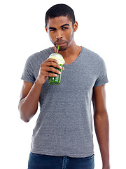 Image showing Man, portrait and green smoothie in studio, nutrition and wink for juice on white background. Black male person, balanced diet and milkshake for weight loss or detox, minerals and organic fiber