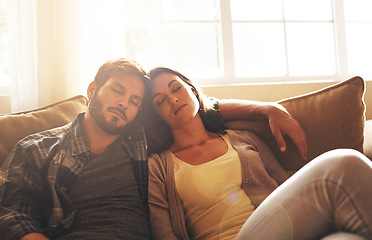 Image showing Sleeping, tired and couple on sofa to relax with sunshine for resting, comfortable and dreaming in home. Marriage, dating and man and woman on couch together for cuddle, nap and asleep in living room