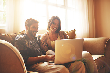 Image showing Happy, relax and couple on sofa with laptop for watching movies, entertainment and streaming in living room. Marriage, love and man and woman on computer for internet, website and online film in home