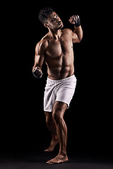 Image showing Man, boxer and portrait in studio for fight, fitness and warrior training on black background. Person, athlete and strong muscles for workout or exercise, health and ready for battle or competition