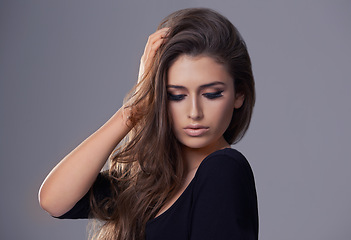 Image showing Aesthetic, hair care and woman with beauty, texture and treatment on a grey studio background. Wellness, person and model with shampoo and keratin with makeup and cosmetics with shine and glowing