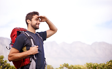 Image showing Man, hike and mountain for recreation in environment and tree for nature and outdoor for fitness. Young person, smile and look with bag for active, walk and adventure for exercise and sport on mockup