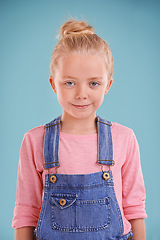 Image showing Child, smile and portrait in studio for fashion, young and growing up for adolescent, innocent and pink. Little girl or kid and happy with denim for junior, childhood and children for joy and cute