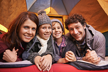 Image showing Portrait, happy family and camping in tent on vacation, holiday or travel together. Face, parents and smile of children at campsite for kids bonding to relax with mother and father on adventure trip