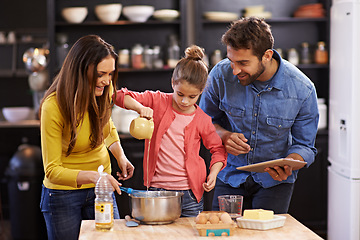 Image showing Family, kitchen and tablet for baking with care, recipe online with ingredients for cake or dessert with support and handmade. Mom, dad and child cooking together with love for bonding or teaching