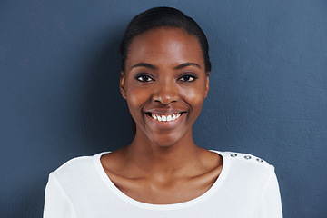 Image showing Black woman, smile portrait and studio for natural cosmetics for skincare and facial glow for beauty. African model, dermatology or happy face with mascara or confident in closeup by blue background