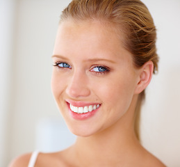 Image showing Face, woman and home with skincare for smile in white background, happy and satisfied with routine results. Portrait, female person and treatment with glow for beauty, self care and confidence.