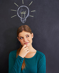 Image showing Idea, thinking and woman with light bulb on chalkboard for inspiration, brainstorming and problem solving. Creative, question and person on background with icon for solution, thoughtful and planning