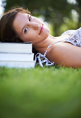 Image showing Books, grass and portrait of woman relax, calm and resting for studying, reading and learning. Education, university and person outdoors for wellness, fresh air and peace with textbooks for knowledge