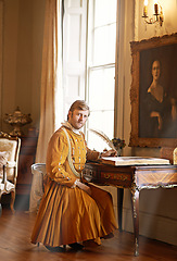 Image showing Man, medieval and portrait with quill or book for renaissance, royalty aesthetic and letter in palace bedroom. Monarch, wealthy person or elegant clothes for cosplay, regal or communication in castle