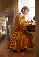 Image showing King, medieval and writing with quill in book for renaissance, royalty aesthetic or letter in palace bedroom. Monarch, wealthy person and elegant clothes for cosplay, regal or communication in castle