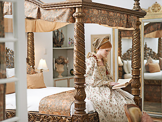 Image showing Woman, queen and book with reading for renaissance, royalty aesthetic and confidence on palace bed. Monarch, wealthy person and elegant dress for cosplay, regal and medieval knowledge in the castle
