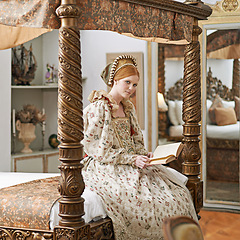 Image showing Woman, queen and book with portrait for renaissance, royalty aesthetic and reading in palace bedroom. Monarch, wealthy person and elegant dress for cosplay, regal and medieval knowledge in the castle