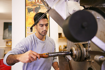 Image showing Man, factory and machine for grinding coffee with roast, process and flavor for export in industry. Person, employee and tools for caffeine, beans or press with manufacturing at warehouse in Colombia