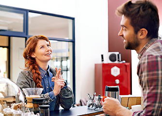 Image showing Woman, customer service and waiter in a cafe, counter and decision with ideas, drink and smile in morning. People, man and order in a coffee shop with choice, happy and chat at restaurant in Italy