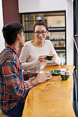 Image showing Happy people, friends and relax with coffee for morning, breakfast or chatting together at indoor restaurant. Young man and woman with smile in happiness for social bonding or talking at cafe table