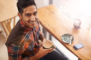 Image showing Happy man, portrait and cafe with coffee for morning, breakfast or relax at indoor restaurant. Face of young male person with smile and enjoying beverage, drink or cappuccino at cafeteria or shop