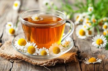Image showing A Cup of Chamomile Tea on a Wooden Table