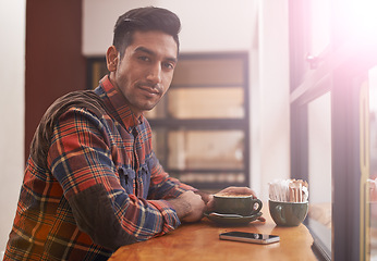 Image showing Man, portrait and coffee by window for morning, breakfast or drink at indoor cafe or restaurant. Male person or freelancer with smile for latte, customer service or cappuccino at cafeteria or shop