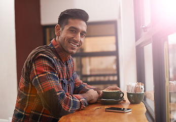 Image showing Happy man, portrait and coffee at cafe for breakfast, morning or drink at indoor restaurant. Young male person or freelancer with smile for latte, customer service or cappuccino at cafeteria or shop