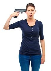 Image showing Depression, gun or portrait of sad woman in studio for stress, warning or mental health crisis on white background. Temple, weapon or lady model frown with anxiety, overthinking or self harm disaster