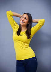 Image showing Woman, laughing and fashion in studio, happy and arms raised for ideas, excited or memory by blue background. Girl, person and model with trendy style, edgy clothes or smile with confidence in Mexico