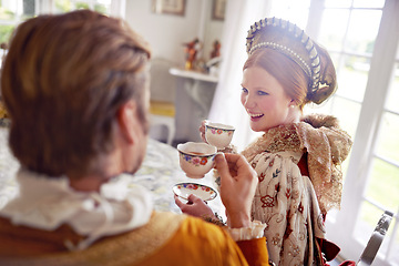 Image showing Royal man, woman and tea in castle with conversation, smile and vintage clothes with style in home. King, queen and couple with drink together in morning with Victorian fashion at regal palace in UK