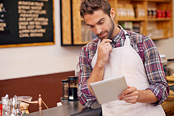 Image showing Man, barista and tablet for reading in cafe with ideas, thinking and decision for online menu. Person, waiter and digital touchscreen for solution, problem solving or order on website in coffee shop