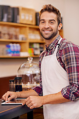 Image showing Man, barista and tablet for portrait in cafe with smile, pride and catering service at startup. Person, waiter and business owner on digital touchscreen for stock, ecommerce and order in coffee shop