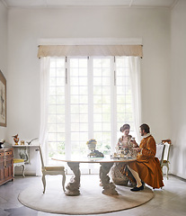 Image showing King, queen and royal couple with tea in castle, smile and talk in vintage clothes with luxury at breakfast. Woman, man and people with drink in morning with Victorian fashion at regal palace in UK