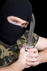 Image showing The murderer with a knife in a black mask