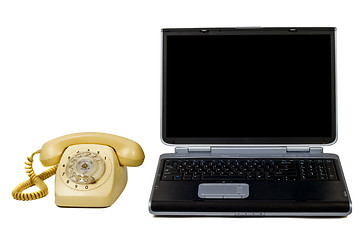 Image showing Laptop and old phone. Isolated on white