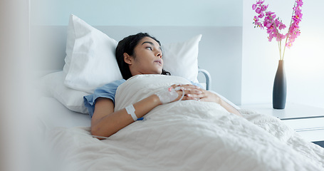 Image showing Hospital bed, woman and stress with thinking about medical support and surgery at a clinic. Anxiety, sad and tired female patient with recovery and healthcare treatment in a ICU room of sick person