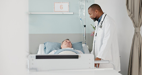 Image showing Consultation, healthcare and doctor with patient in hospital after surgery, treatment or procedure. Discussion, checkup and African male medical worker talk to senior man in clinic bed for diagnosis.