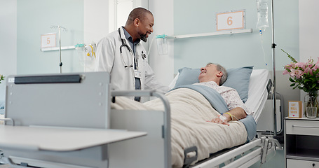 Image showing Consultation, medical and doctor with patient in hospital after surgery, treatment or procedure. Discussion, checkup and African male healthcare worker talk to senior man in clinic bed for diagnosis.