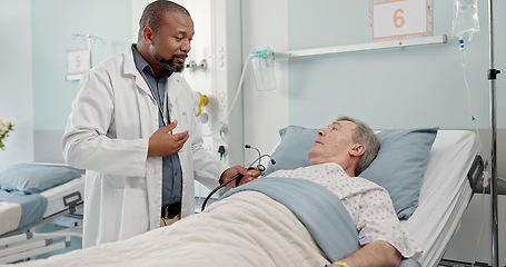 Image showing Medical stethoscope and doctor with patient in hospital after surgery, treatment or procedure. Discussion, checkup and African male healthcare worker talk to senior man in clinic bed for diagnosis.