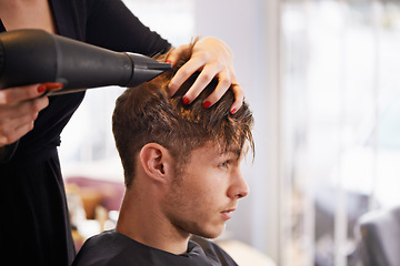 Image showing Customer, hairdryer and man with hairdresser for professional haircare, styling or drying with luxury treatment. Grooming, hair and client at salon for care, wellness and small business with service