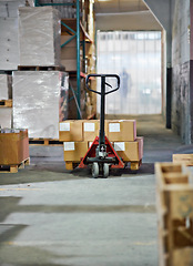 Image showing Trolley, boxes and packages with shipment in supply chain, distribution or storage at warehouse. Empty factory or interior of equipment for parcel transportation, logistics or inventory at depot