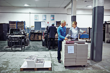 Image showing Printing, factory and people with paper for inspection, collaboration and quality control with paper. Warehouse, teamwork and man and woman for logistics, manufacturing and industrial production