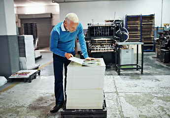 Image showing Printing, factory and mature man with paper for quality control, design or product inspection. Warehouse, print workshop and person for logistics, manufacturing and industrial production in workshop