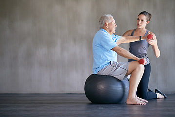 Image showing Physical therapy, dumbbells and senior man on ball for fitness, rehabilitation or exercise at gym on mockup. Elderly person, weightlifting and training with physiotherapist for help or body health