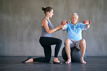 Image showing Physical therapy, dumbbells and senior man exercise on ball for fitness or rehabilitation at gym on mockup space. Elderly person, weightlifting and physiotherapist help for body health or wellness