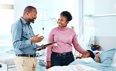 Image showing Doctor, clinic and child with medical, checkup and consultation for health and wellness. Pediatrician, kid and hospital bed with plush bear, comfort and good news for healthcare and life insurance