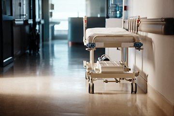 Image showing Dark, hospital and bed in a hallway, healthcare and wellness with furniture and Interior with help or risk. Ward, clinic or emergency service with surgery or medical center with bacteria or hygiene