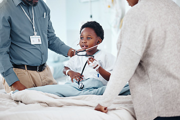 Image showing Doctor, hospital and child with medical, stethoscope and consultation for health and wellness. Pediatrician, kid and bed with communication, comfort and good news for healthcare and life insurance