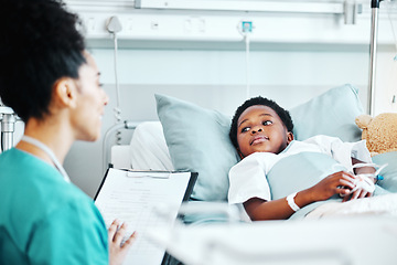 Image showing Clipboard, doctor and child in bed at hospital for recovery of surgery, illness or medical diagnosis. Healthcare, consultation and female pediatrician talking to African kid patient resting in clinic