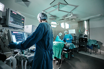 Image showing Screen, monitor or doctor in emergency surgery, professional care and hospital for support. Press, help and surgeon in operation or mask to check healthcare or track heart rate in medical results