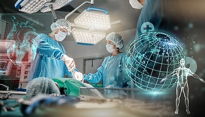 Image showing Doctors, hospital and hologram globe with surgery in operating room in scrubs, ppe and help for emergency. Surgeon, group and procedure in icu, 3d overlay and cardiology with heart wellness at clinic